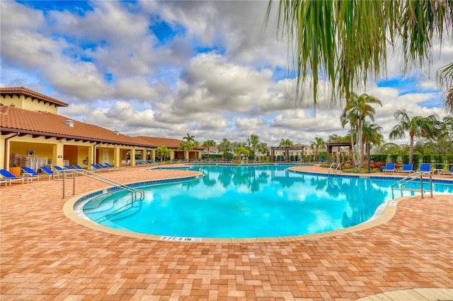 view of pool featuring a patio