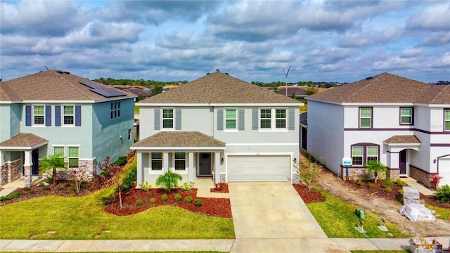 view of front of property with a garage and a front yard