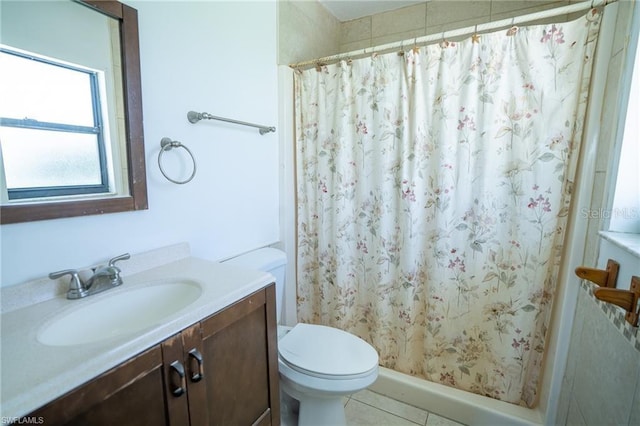 bathroom featuring vanity, toilet, tile patterned flooring, and a shower with curtain