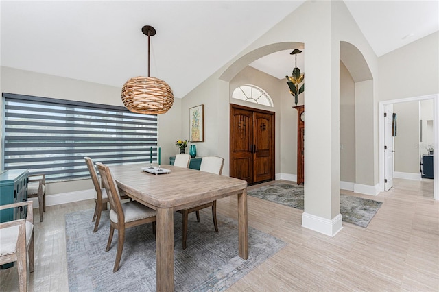 dining space with vaulted ceiling