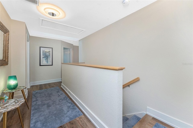 hallway with dark hardwood / wood-style floors