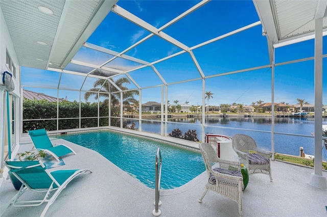 view of swimming pool featuring a water view, a patio, and a lanai