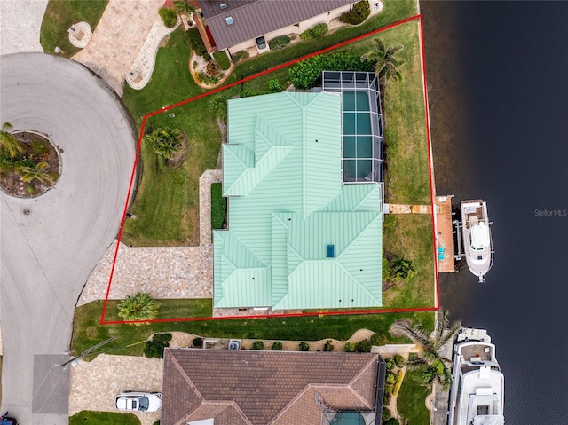 birds eye view of property with a water view