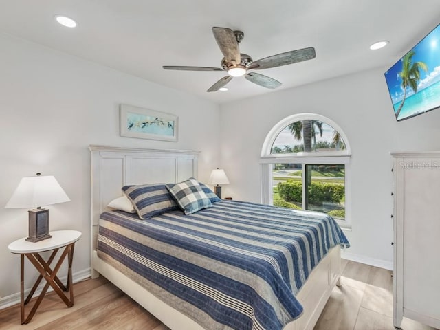 bedroom featuring light wood-type flooring and ceiling fan