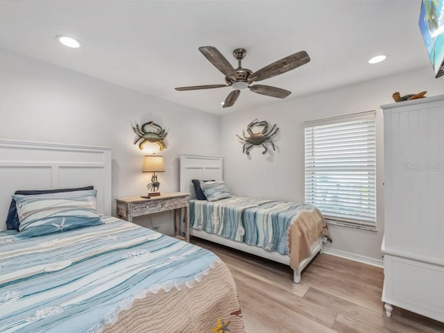 bedroom featuring ceiling fan and light hardwood / wood-style floors