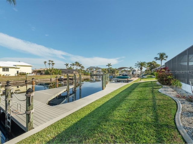 view of dock featuring a yard and a water view