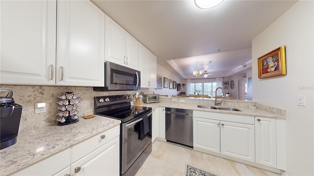 kitchen with sink, white cabinetry, and appliances with stainless steel finishes