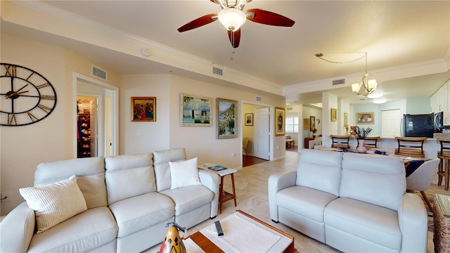 living room featuring ceiling fan and ornamental molding