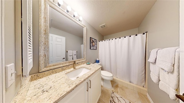 bathroom featuring toilet, a textured ceiling, curtained shower, tile patterned floors, and vanity