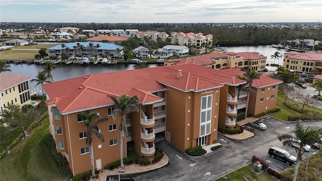 birds eye view of property featuring a water view