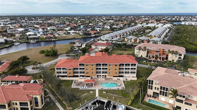 birds eye view of property featuring a water view