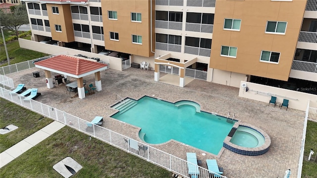 view of swimming pool with a gazebo and a hot tub