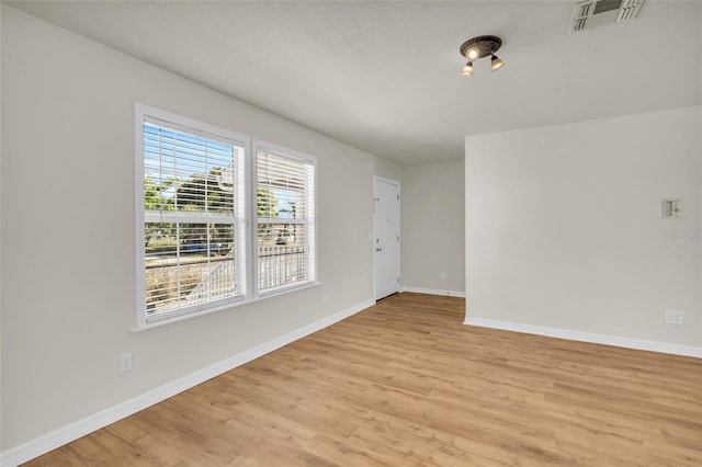 empty room with light wood-type flooring