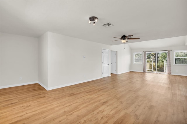 unfurnished living room with ceiling fan, lofted ceiling, and light hardwood / wood-style flooring