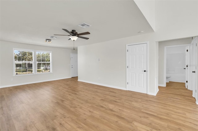 spare room with light hardwood / wood-style flooring and ceiling fan