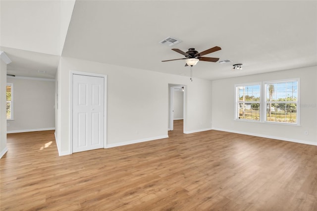 unfurnished room featuring ceiling fan and light hardwood / wood-style flooring