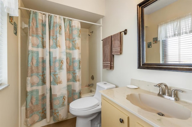 full bathroom with vanity, toilet, and shower / bath combo