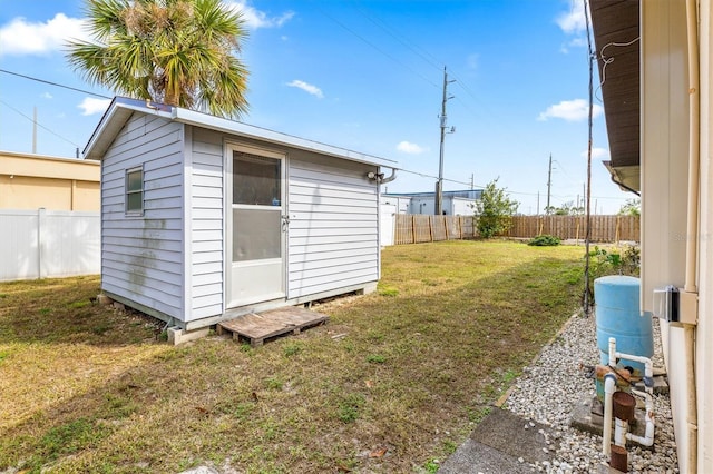 view of outbuilding featuring a yard