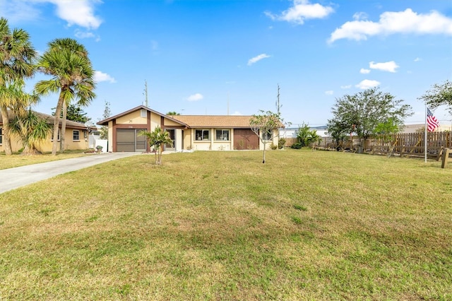 ranch-style house featuring a garage and a front lawn