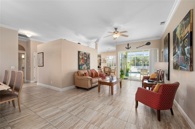 living room with ceiling fan and ornamental molding