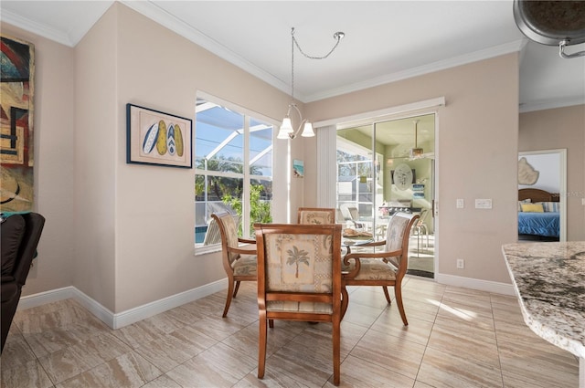 dining space with ornamental molding and an inviting chandelier