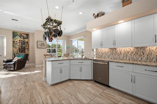 kitchen with dishwasher, white cabinetry, decorative backsplash, sink, and light stone counters