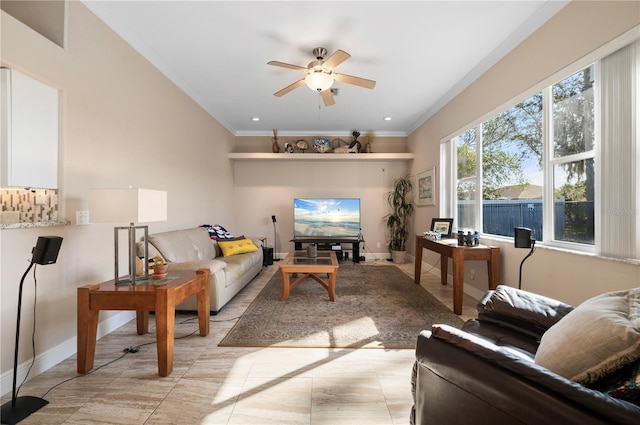 living room with ceiling fan and ornamental molding