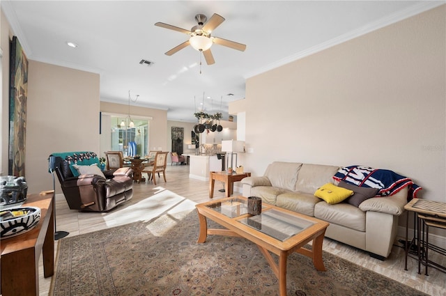 living room featuring crown molding and ceiling fan with notable chandelier