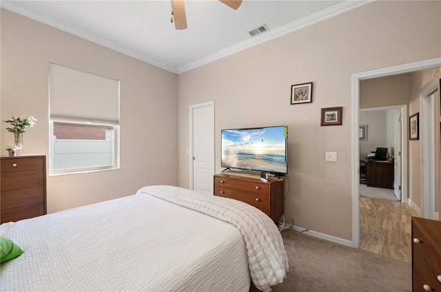 carpeted bedroom featuring ceiling fan and ornamental molding