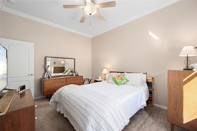 carpeted bedroom featuring ceiling fan and ornamental molding