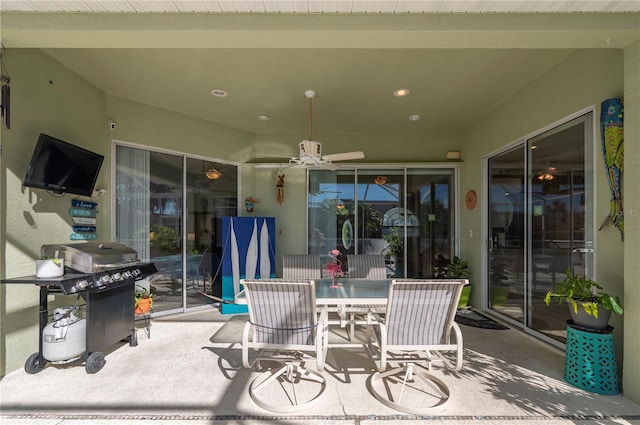 view of patio with ceiling fan and grilling area