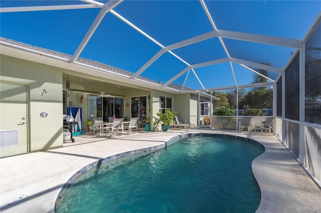 view of pool with a patio and a lanai