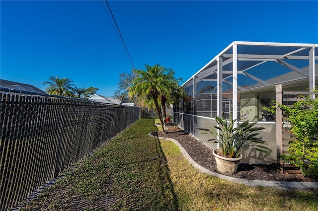 view of yard featuring a lanai