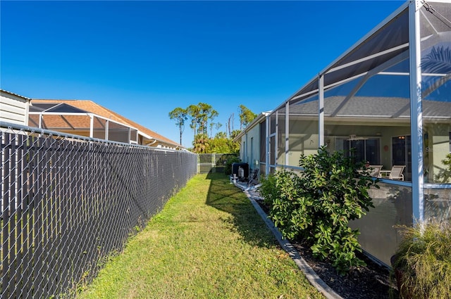 view of yard with a lanai