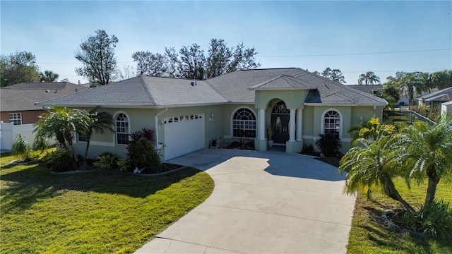 view of front facade with a garage and a front yard