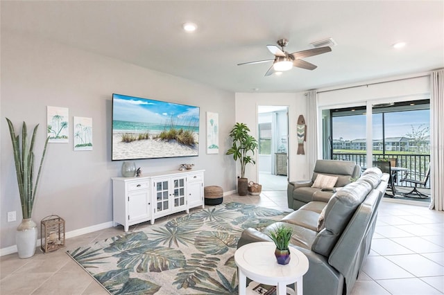 tiled living room featuring ceiling fan