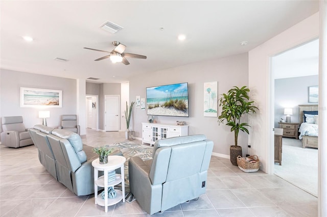 tiled living room featuring ceiling fan