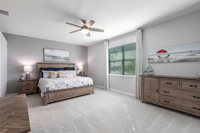 bedroom featuring ceiling fan and light carpet