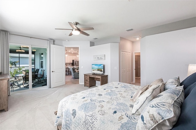 bedroom with ceiling fan, access to exterior, and light carpet