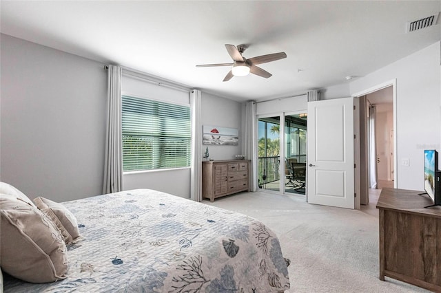 bedroom with access to outside, light colored carpet, and ceiling fan