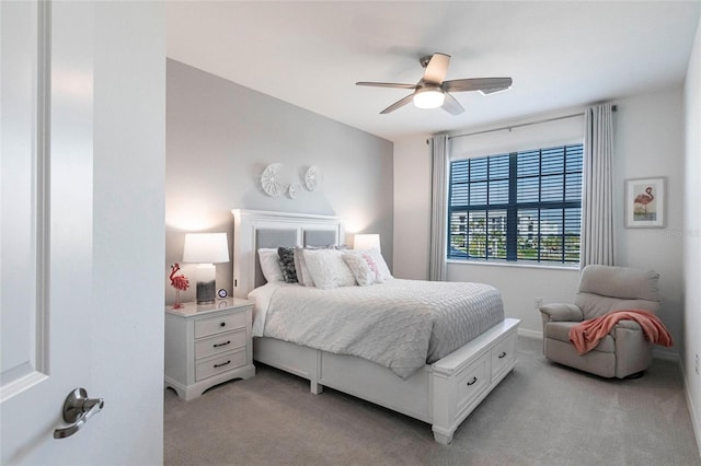 bedroom with light colored carpet and ceiling fan