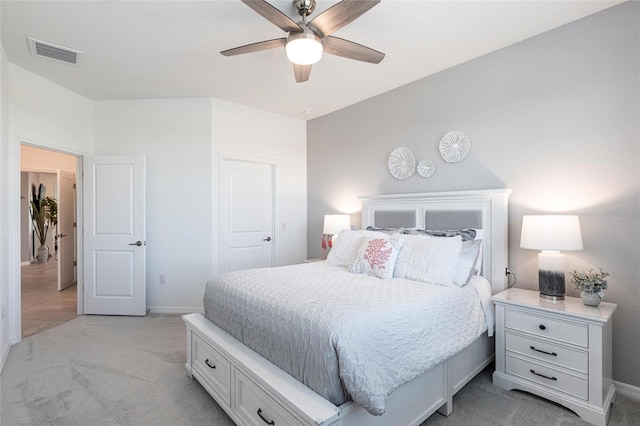 bedroom with ceiling fan and light colored carpet