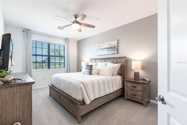 bedroom with light colored carpet and ceiling fan