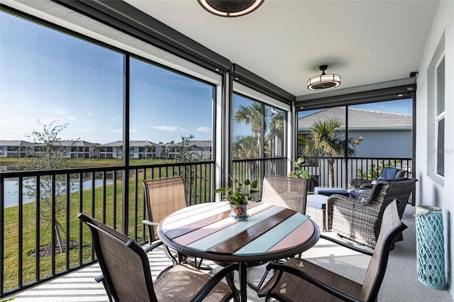 sunroom with a water view