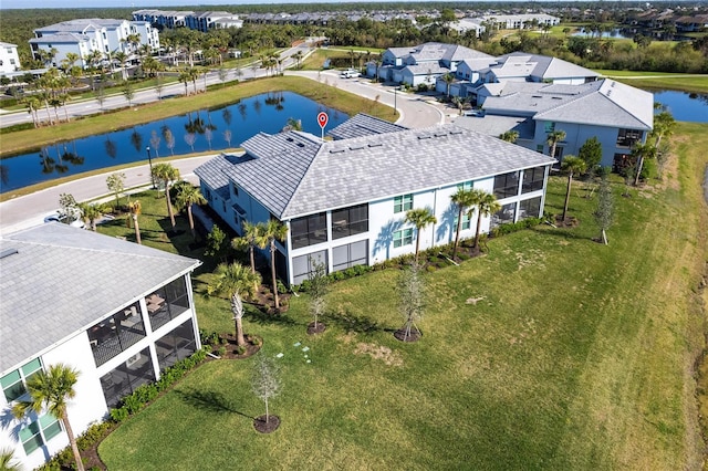 birds eye view of property featuring a water view