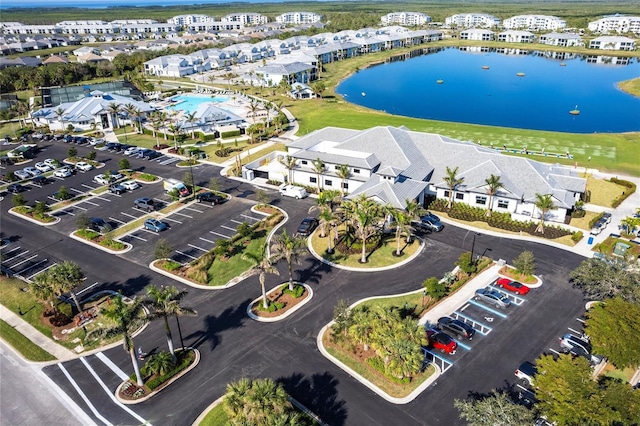 birds eye view of property with a water view