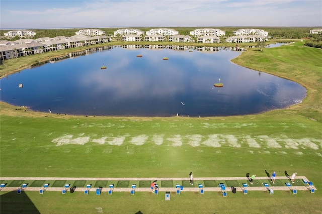 birds eye view of property with a water view