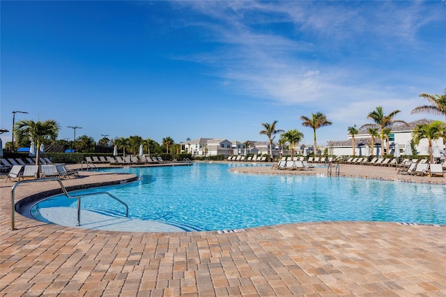 view of swimming pool featuring a patio area