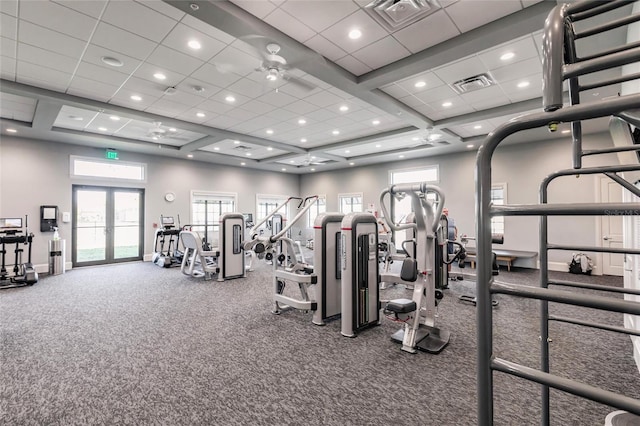 gym with plenty of natural light, french doors, ceiling fan, and a high ceiling