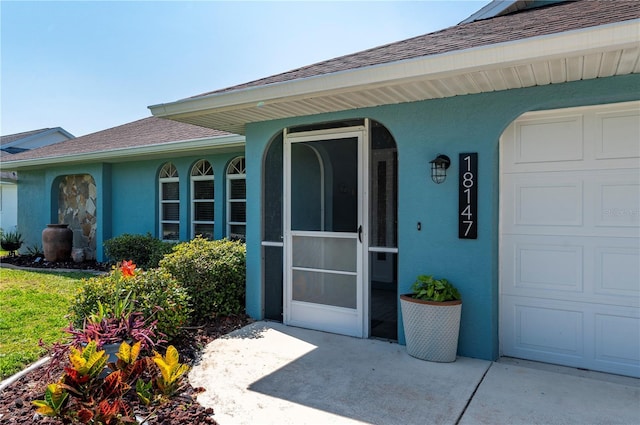 entrance to property featuring a garage